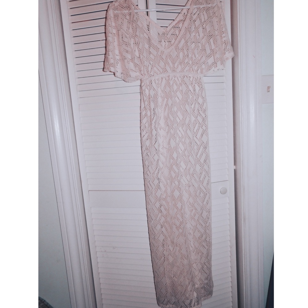 An ivory, knit, floor length bathing suit cover